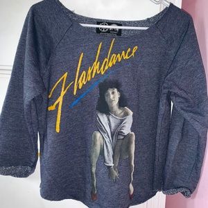 “Flashdance” movie off-shoulder crewneck.